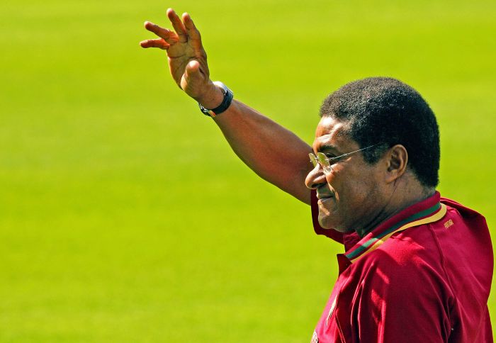 (FILES) — A file picture taken on June 18, 2006 shows Football legend and former Portugal’s national team player Eusebio da Silva Ferreira, more commonly known as Eusebio, waving to the crowd during Portugal’s team training session at the Heidewald Stadium in Gutersloh. Eusebio died at age 71 on January 5, 2014. AFP PHOTO/ NICOLAS ASFOURI