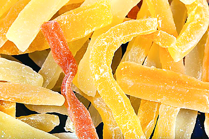 Dried multicolor papaya bars close view