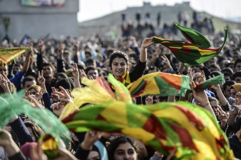 Kurdish people attend a celebration rally near the Turkish-Syrian border at Suruc, in Sanliurfa province on January 27, 2015. Kurdish fighters have expelled Islamic State group militants from the Syrian border town of Kobane, a monitor and spokesman said today, dealing a key symbolic blow to the jihadists’ ambitions.