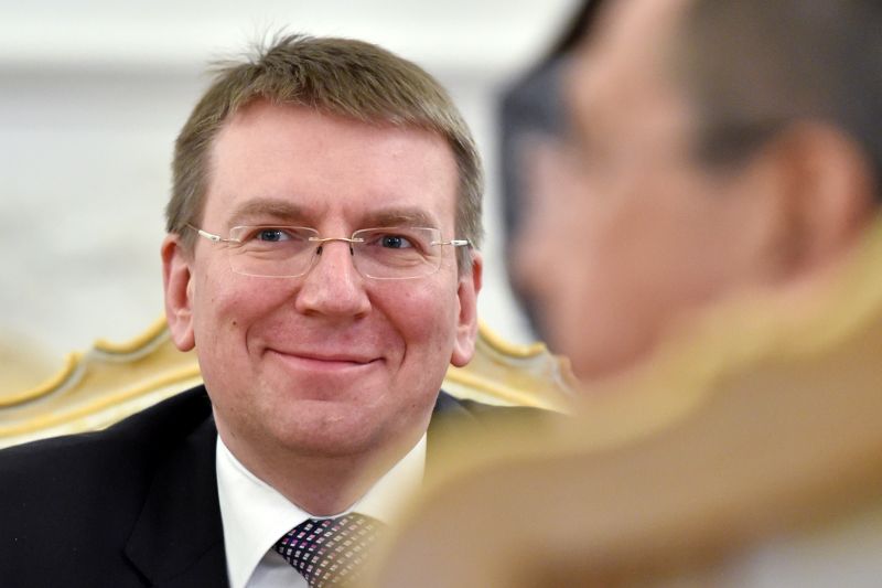 Latvian Foreign Minister Edgar Rinkevics smiles during a meeting with his Russian counterpart in Moscow on January 12, 2015.