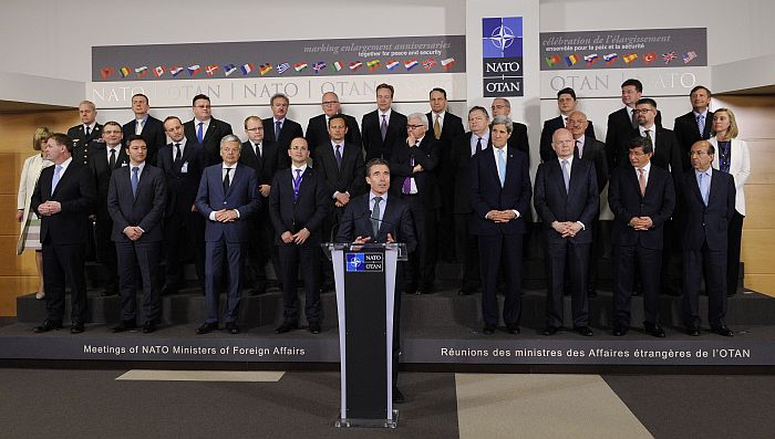 NATO Secretary General Anders Fogh Rasmussen (C) delivers a speech in front of NATO’s Foreign Affairs ministers during a ceremony to mark the anniversaries of NATO enlargement and official photo on the first day of the Foreign Affairs ministers’ meeting at the NATO headquarters in Brussels on April, 1 2014. AFP PHOTO / POOL / JOHN THYS